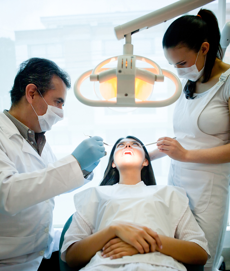 woman in dental chair being examined by dentist, Woodbridge, VA dental restorations